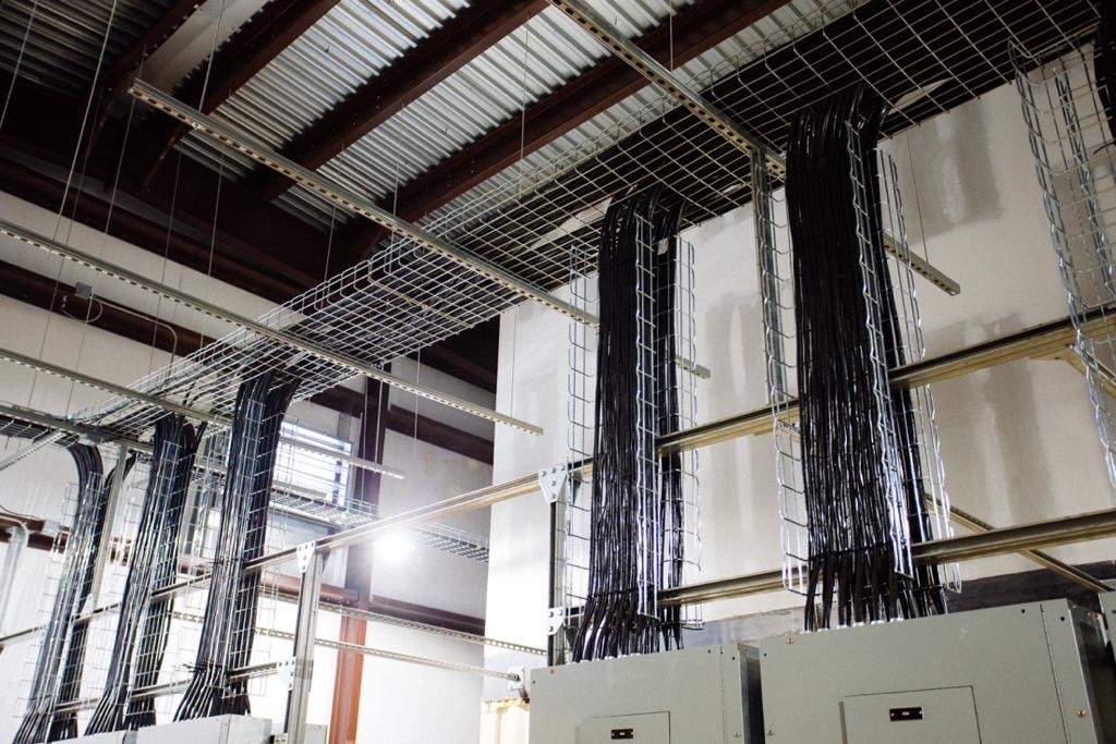 Exposed cable trays and electrical distribution equipment