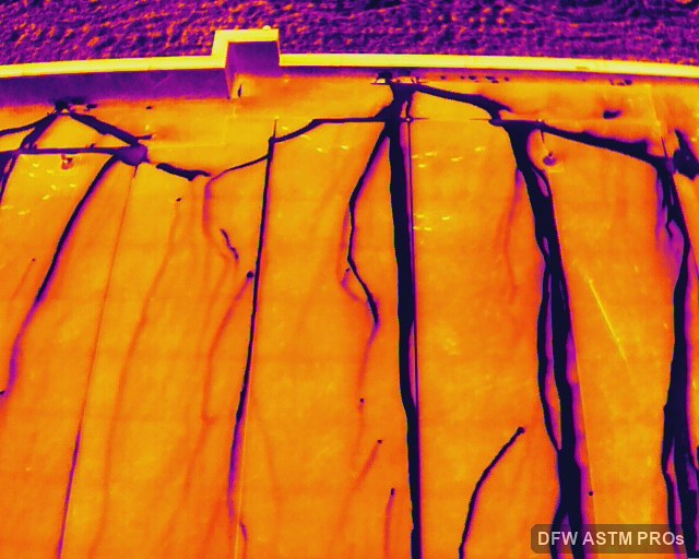 Oblique thermal image showing branching dark patterns across a new TPO roof